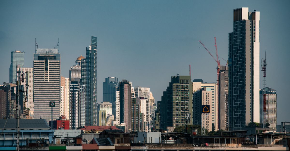 Stunning view of Bangkok's modern skyscrapers under a clear blue sky, perfect for travel inspiration.