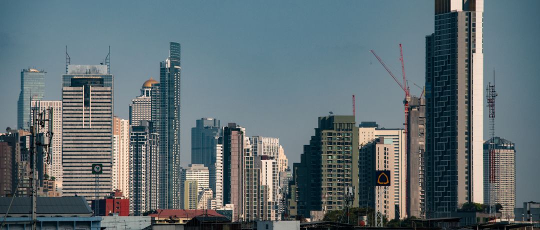 Stunning view of Bangkok's modern skyscrapers under a clear blue sky, perfect for travel inspiration., Bangkok, Thailand, stay connected here with a travel eSIM