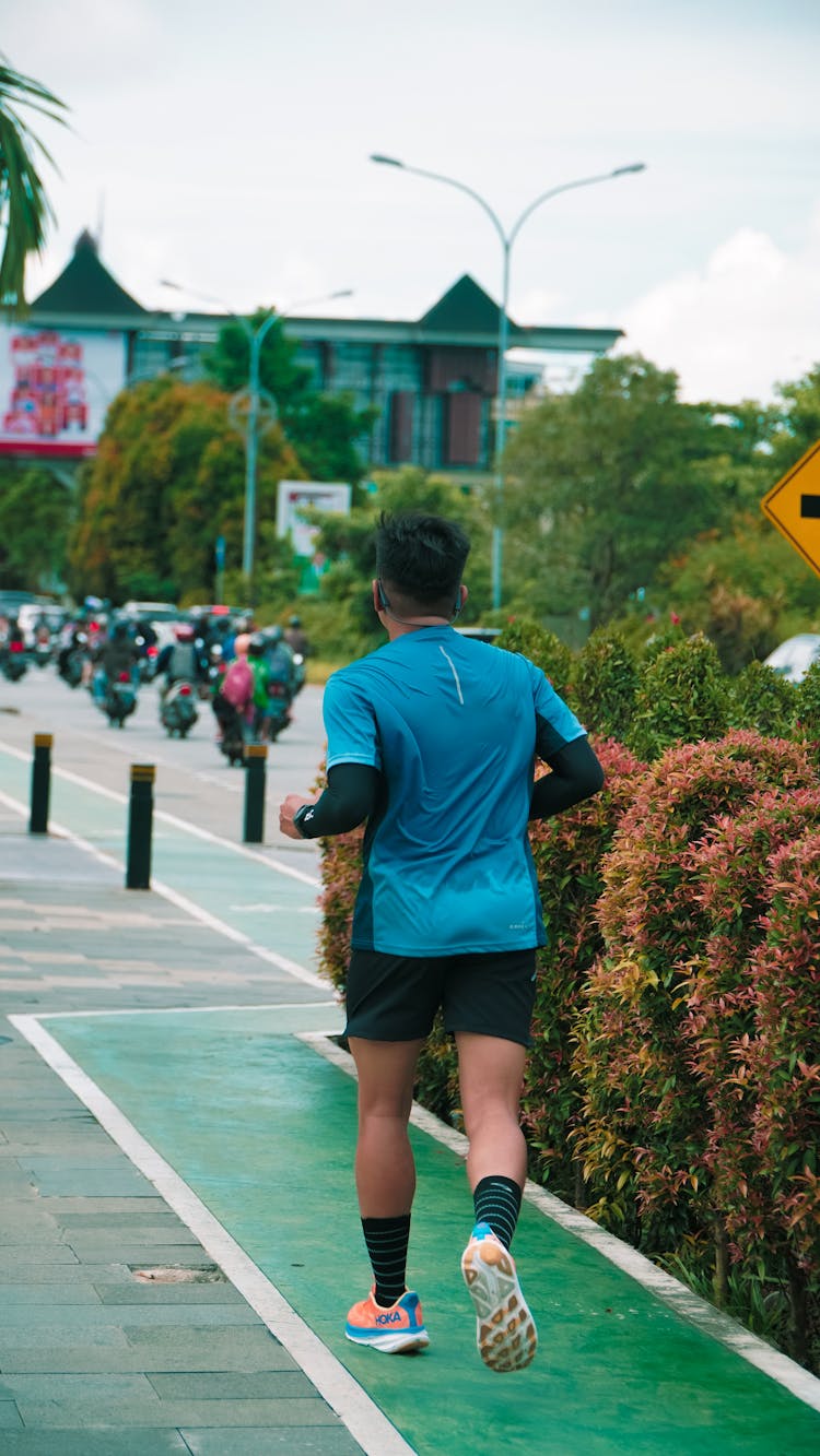 Man Running On A Road 