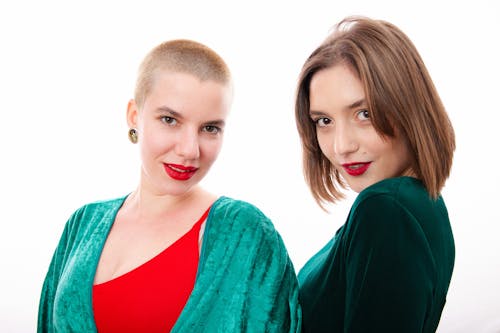 Women in Green Clothes Posing in Studio