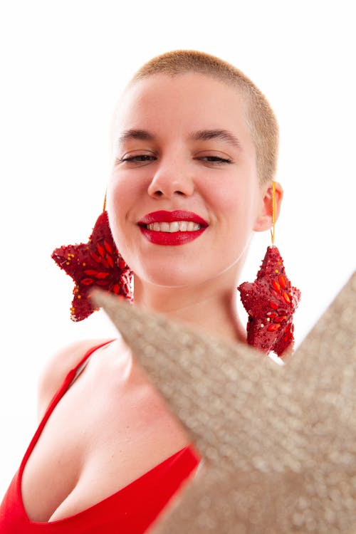 Smiling Woman with Christmas Earrings