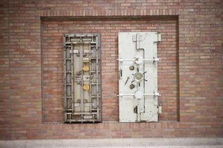 Heavy steel vault door — photo by wutthichai charoenburi on Pexels