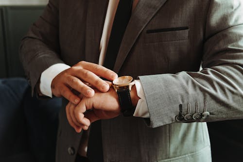 Man in a Suit Wearing a Wristwatch 