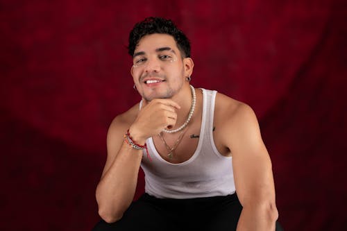 Smiling Man in White Tank Top