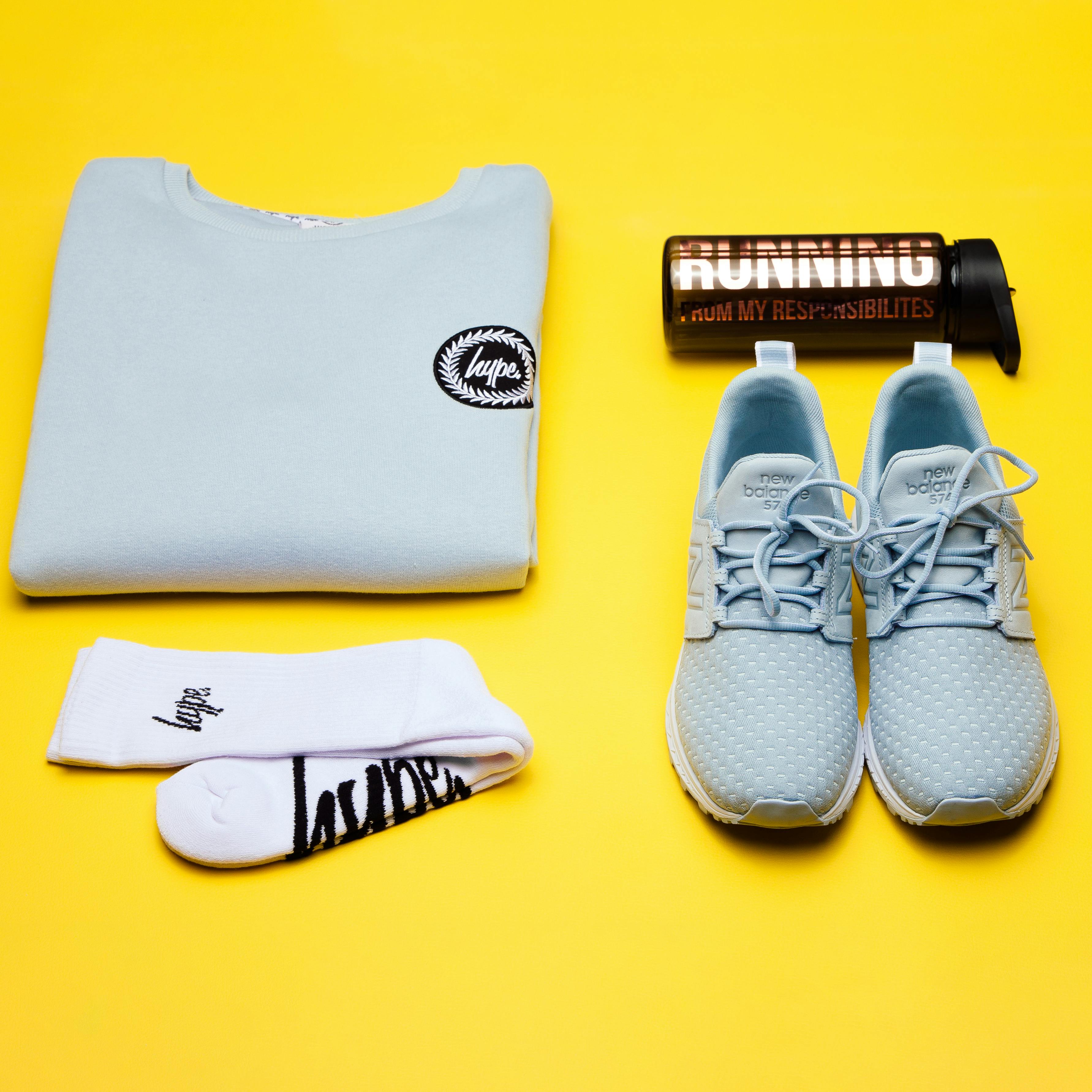 Person wearing a loose fit midweight logo sleeve graphic sweatshirt outdoors