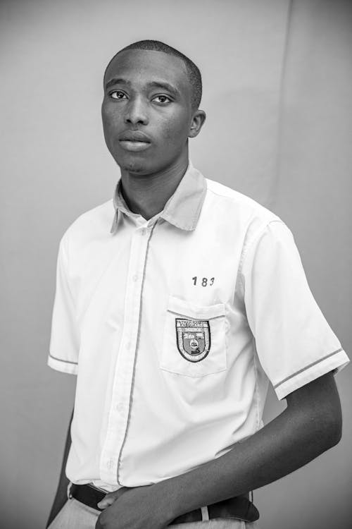 Black and White Photo of a Young Man in a White Shirt 