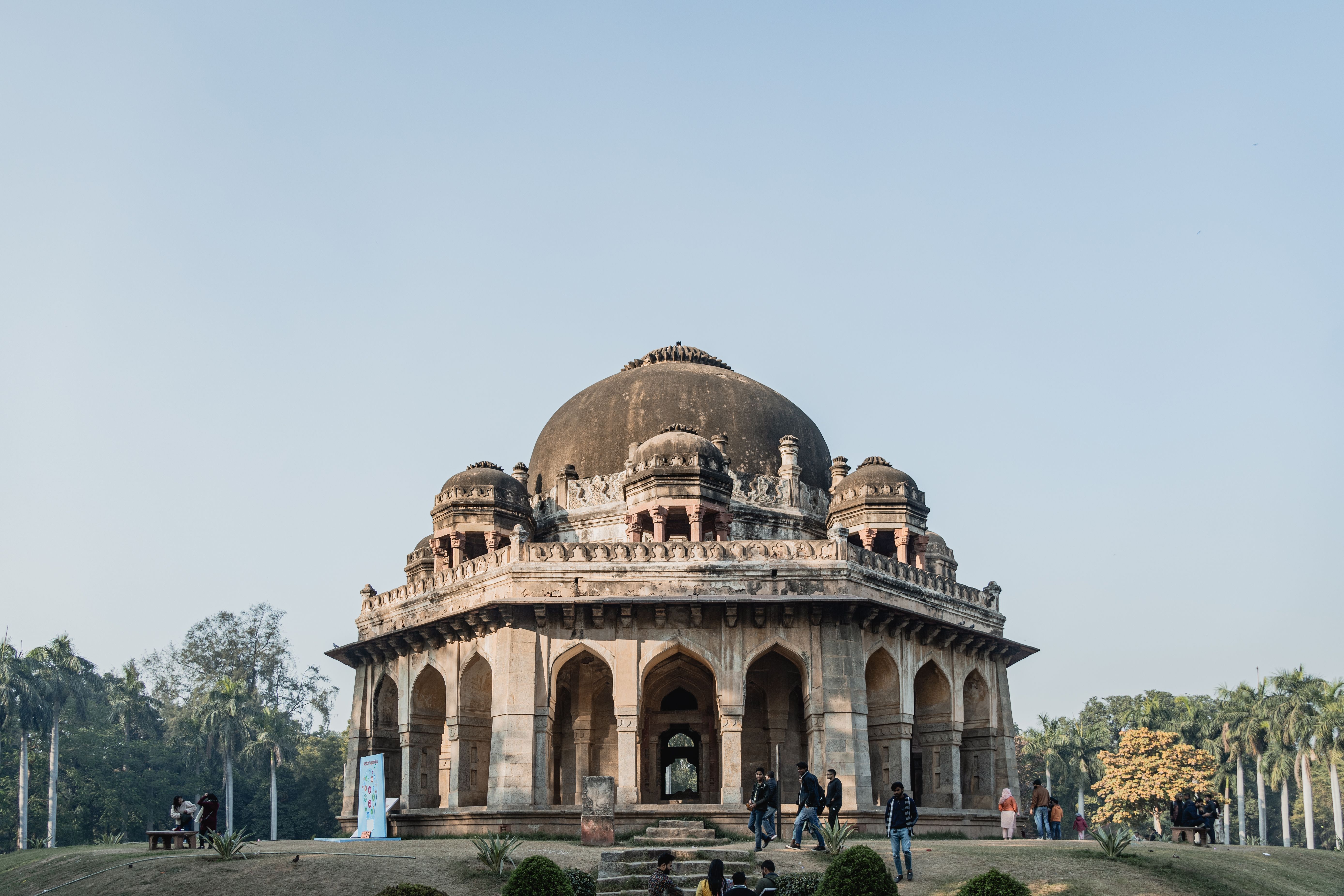 The domed tomb of Jamali Kamali among trees in Mehrauli Archaeological Park