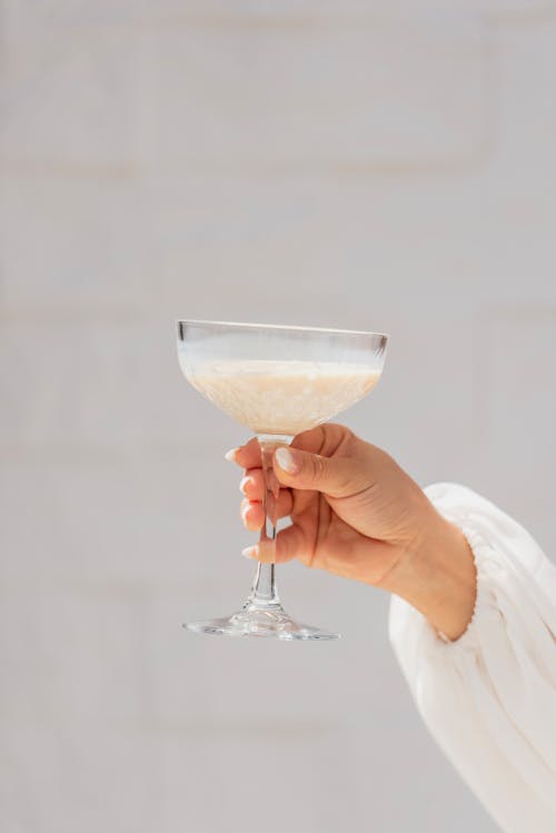 Woman Hand Holding Glass of Drink