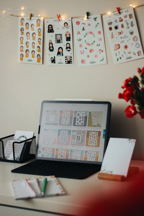 Free Laptop and a Notebook on the Desk Stock Photo