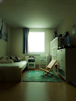 Peaceful modern bedroom interior in Switzerland with soft lighting and tidy arrangement.