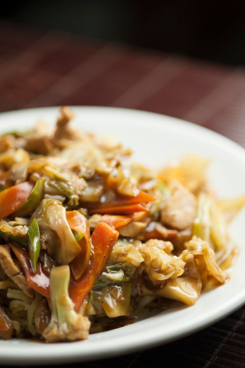 Free Close-up of a mouthwatering stir-fried vegetable dish with vibrant colors and rich textures. Stock Photo