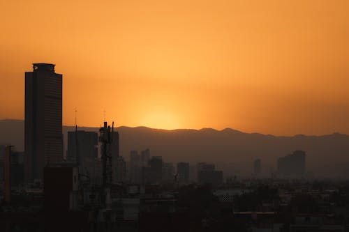 Yellow Sky over City at Sunset