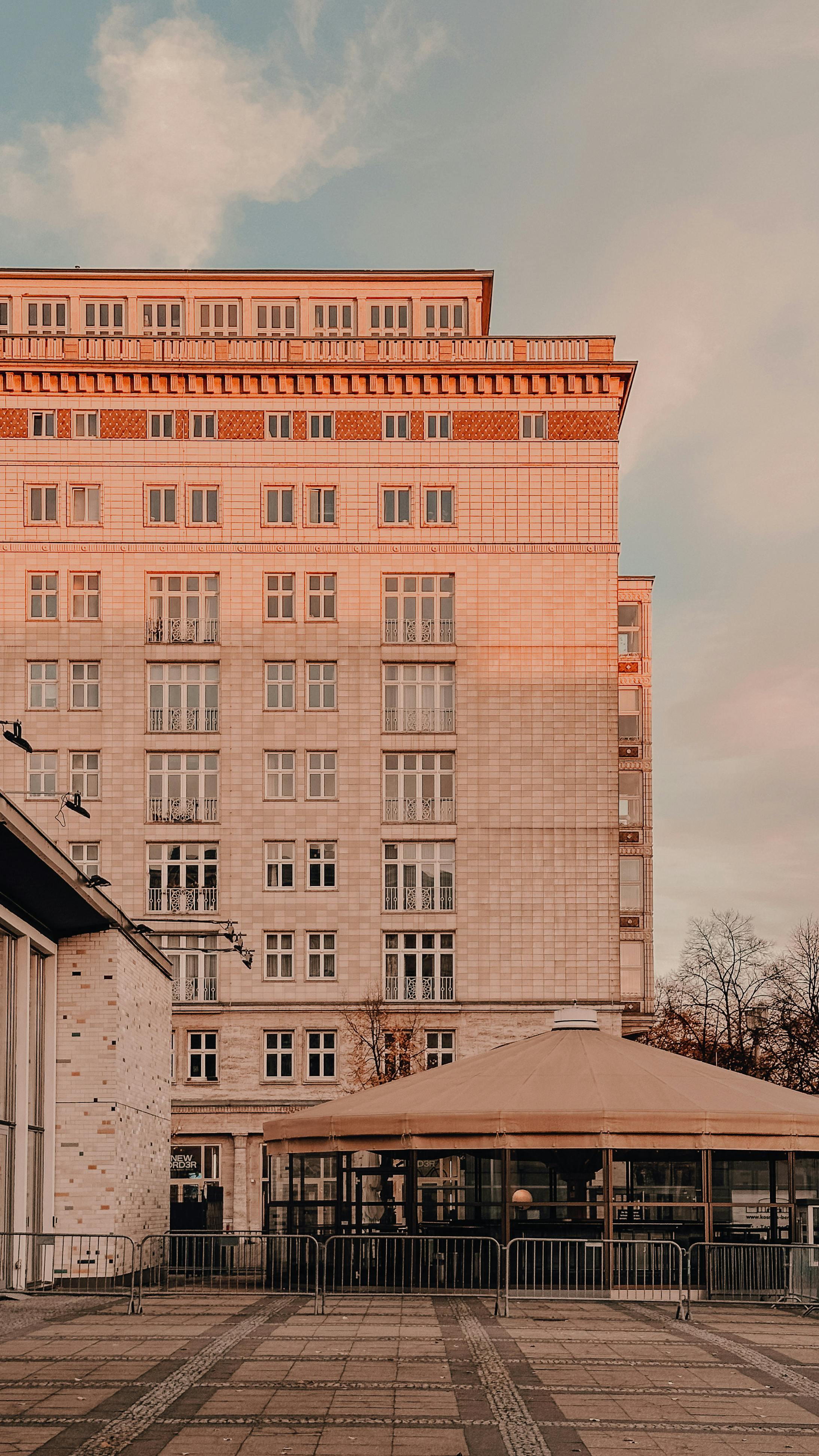 Classic architecture of a Berlin building captured during sunset, highlighting warm tones.