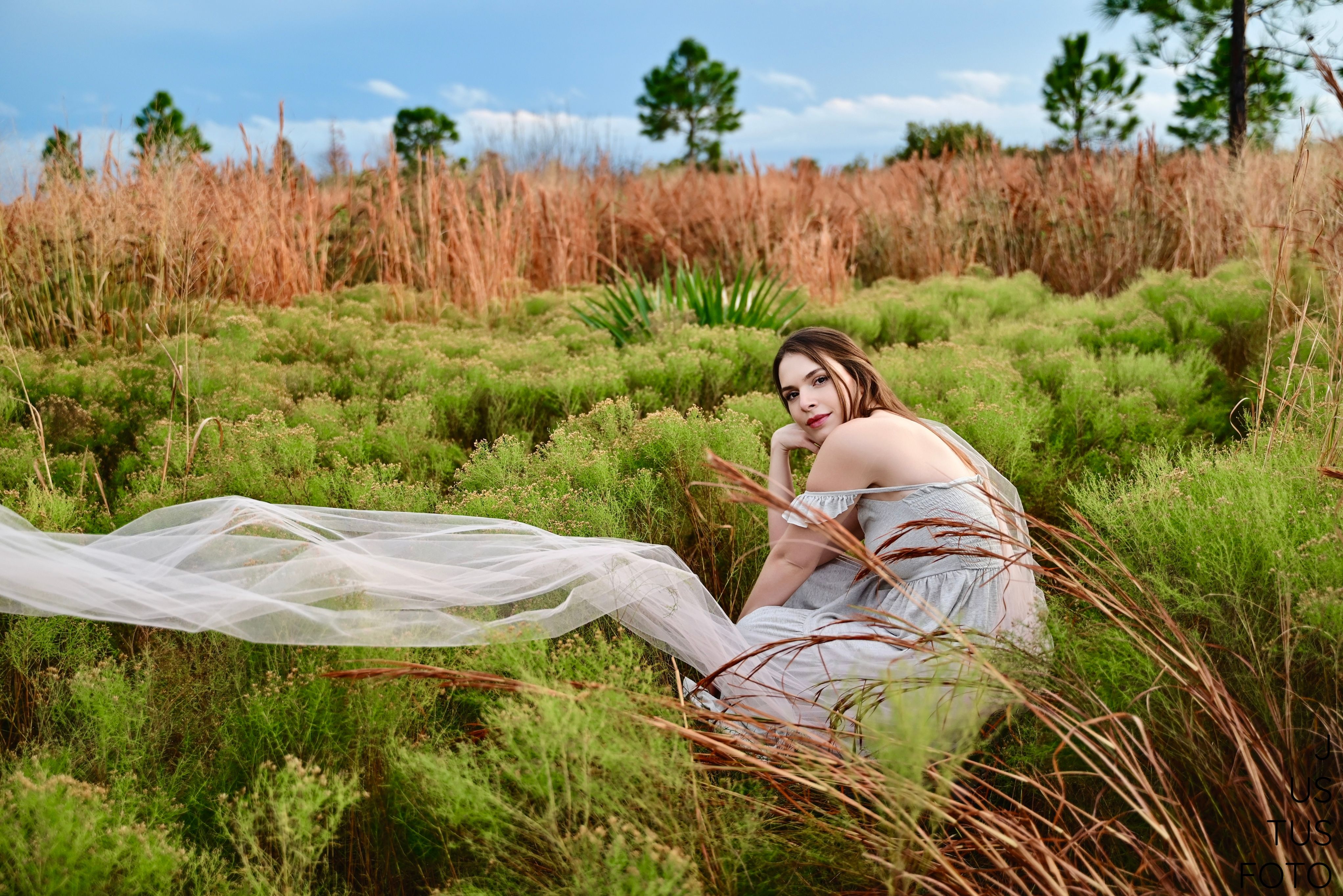 Model in Dress Posing in Rural Scenery · Free Stock Photo