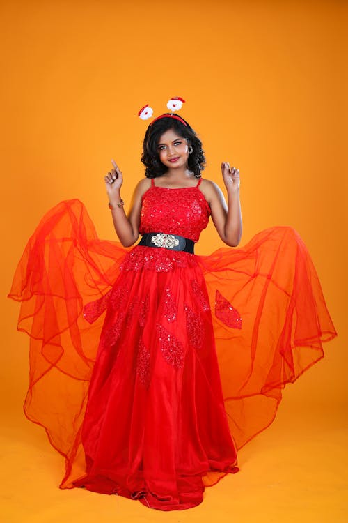 Woman Posing in Orange Dress 