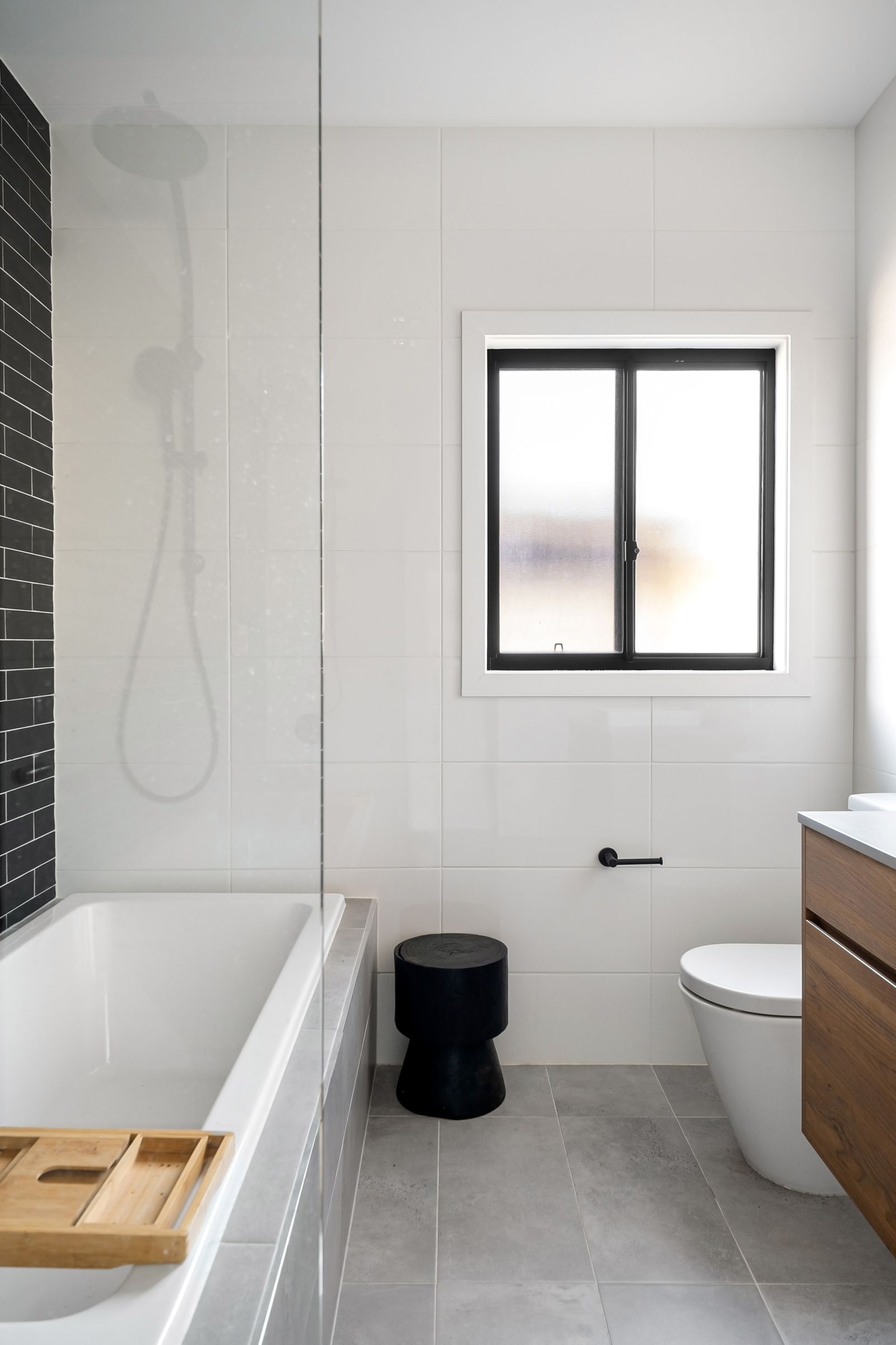 Bathroom renovation with marble tile and freestanding tub