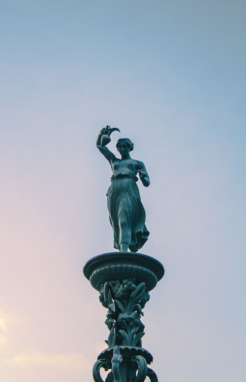 Free Majestic bronze statue in Santiago de Querétaro with classic style against clear sky. Stock Photo