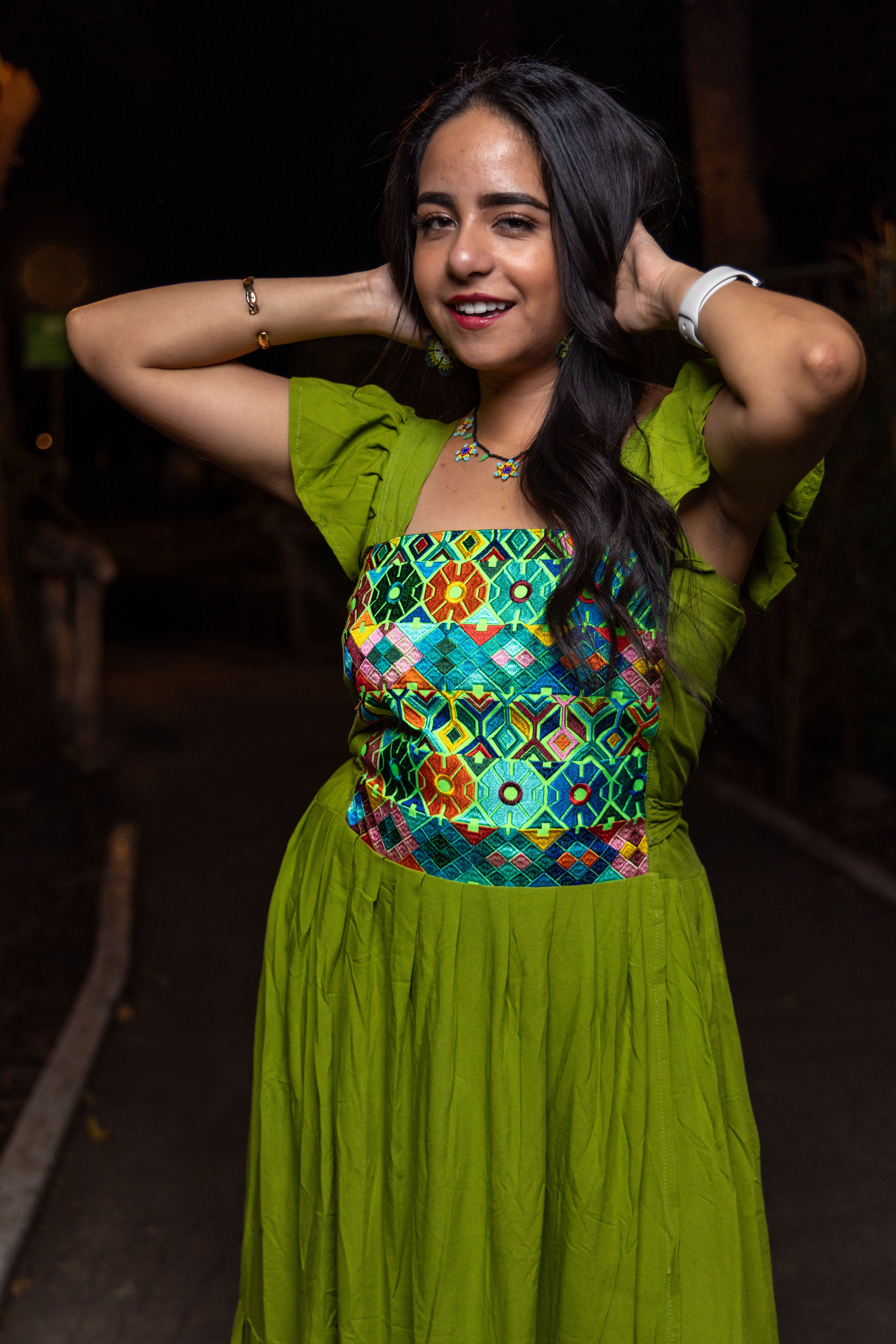 A woman in a green dress posing for a photo  Free Stock Photo