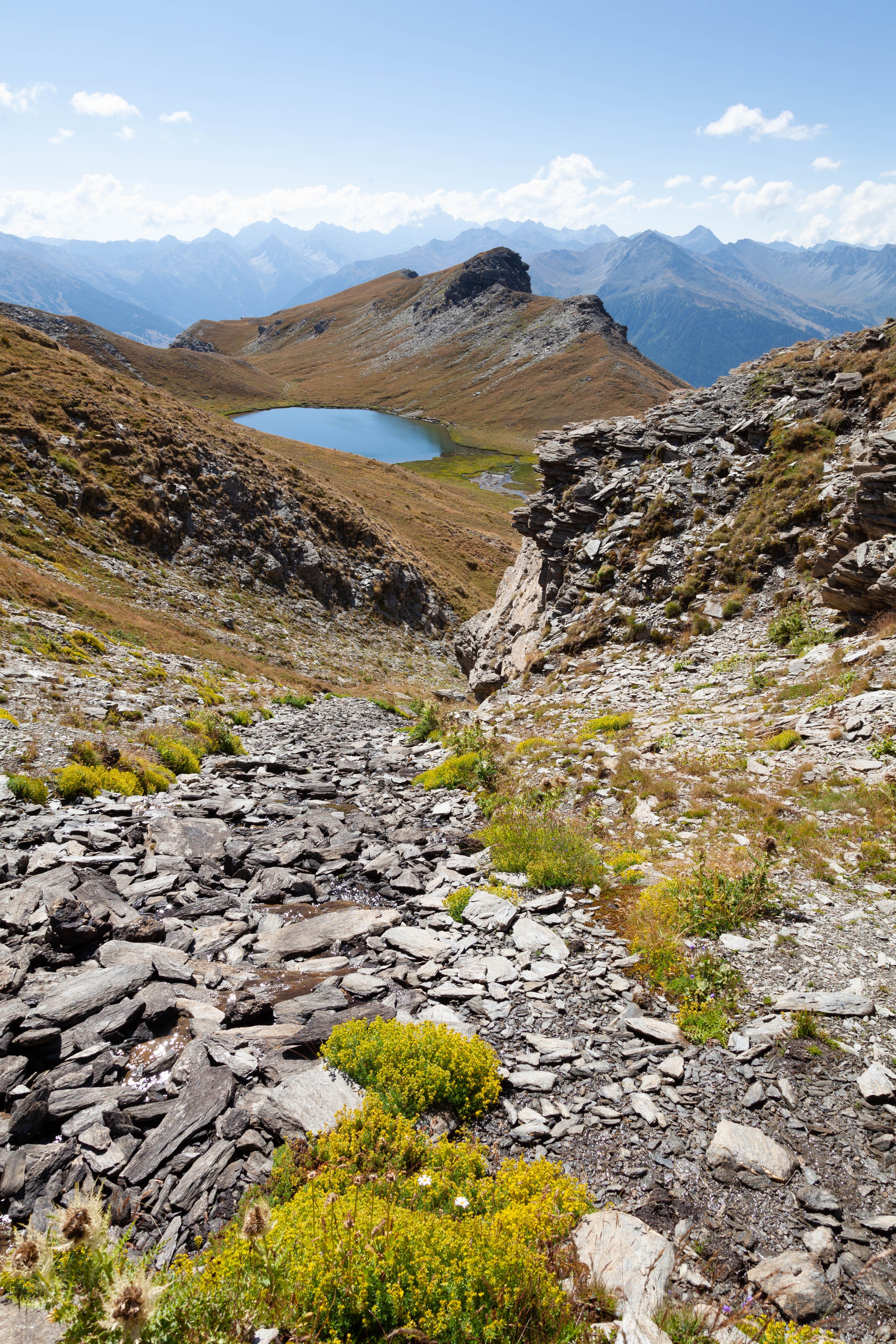 Mountain Slope Covered with Slate Leading to Lake Mezan · Free Stock Photo