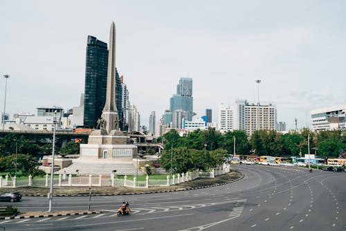 A view of a city with a monument in the middle