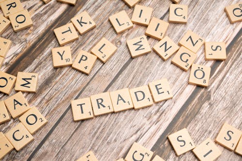 Trade and trade related words on wooden table