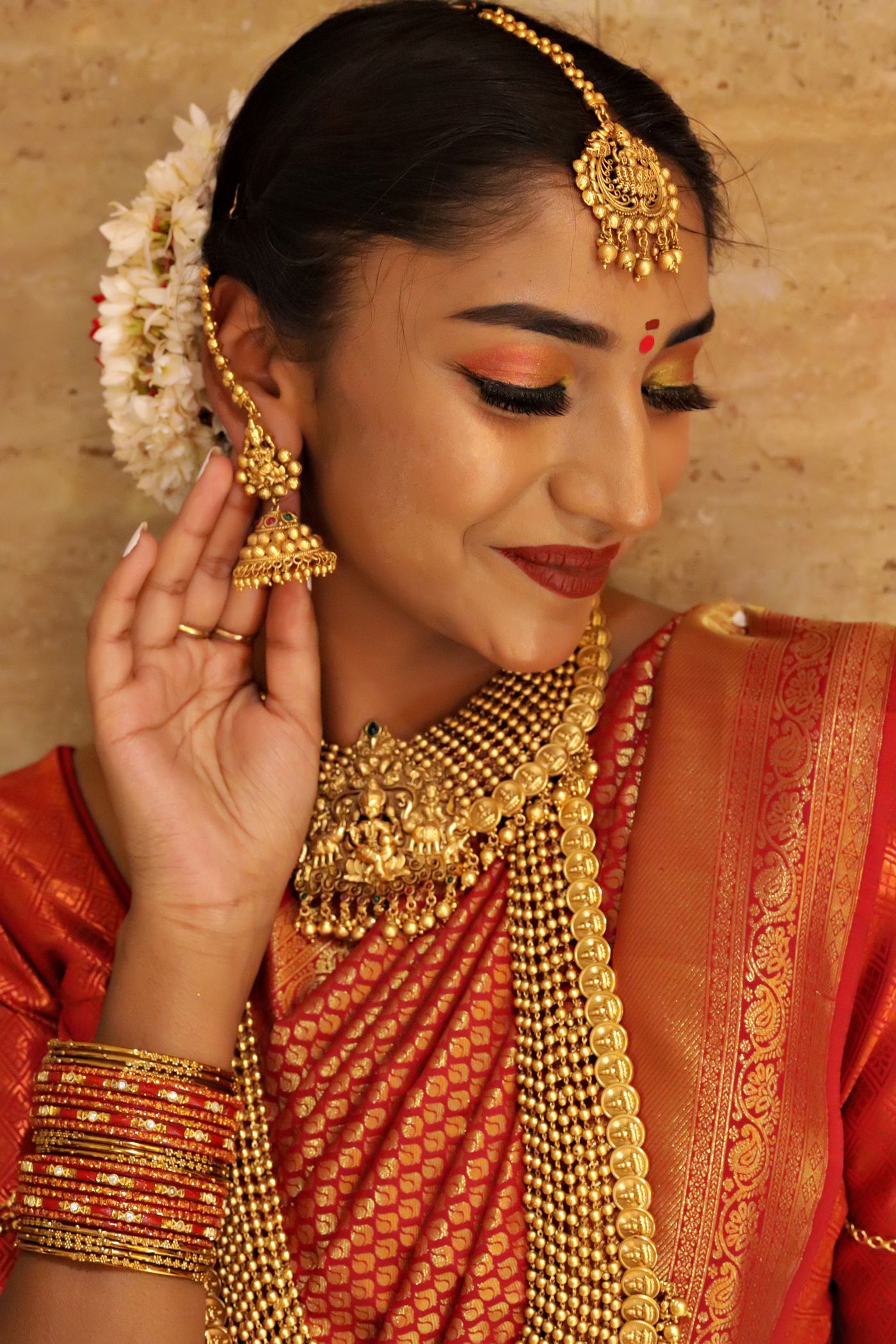 Indian bride wearing traditional jewellery and bridal makeup