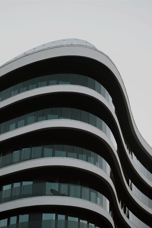 Free A unique curved facade of a modern building in Hungary showcasing contemporary architecture. Stock Photo