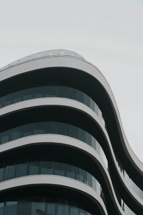 Free A close-up of a contemporary wavy building facade in Hungary, showcasing urban modern architecture. Stock Photo
