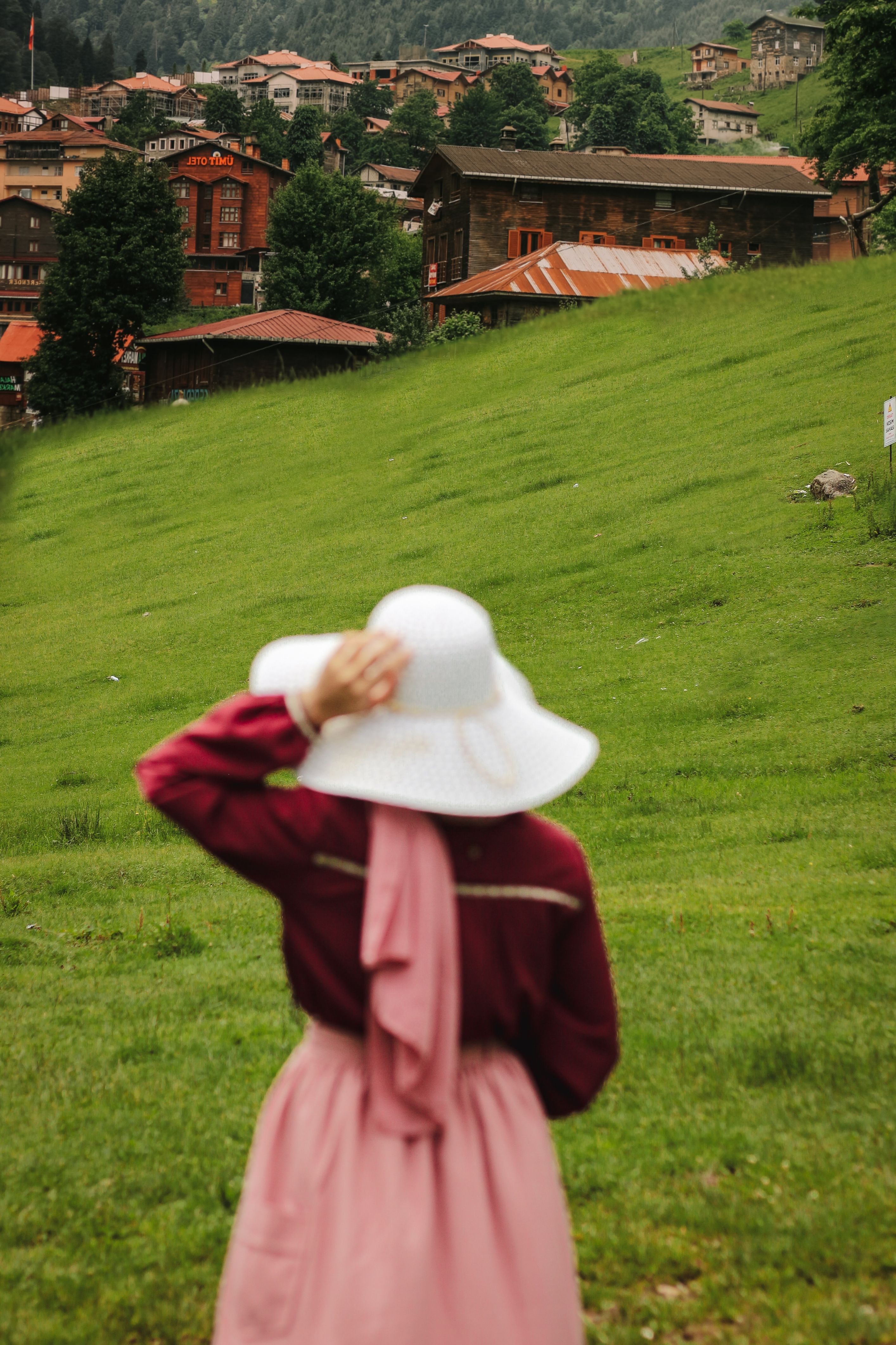 Woman in Hat on Grassland in Village · Free Stock Photo