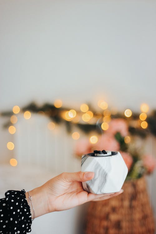 Woman Hand Holding Christmas Candle