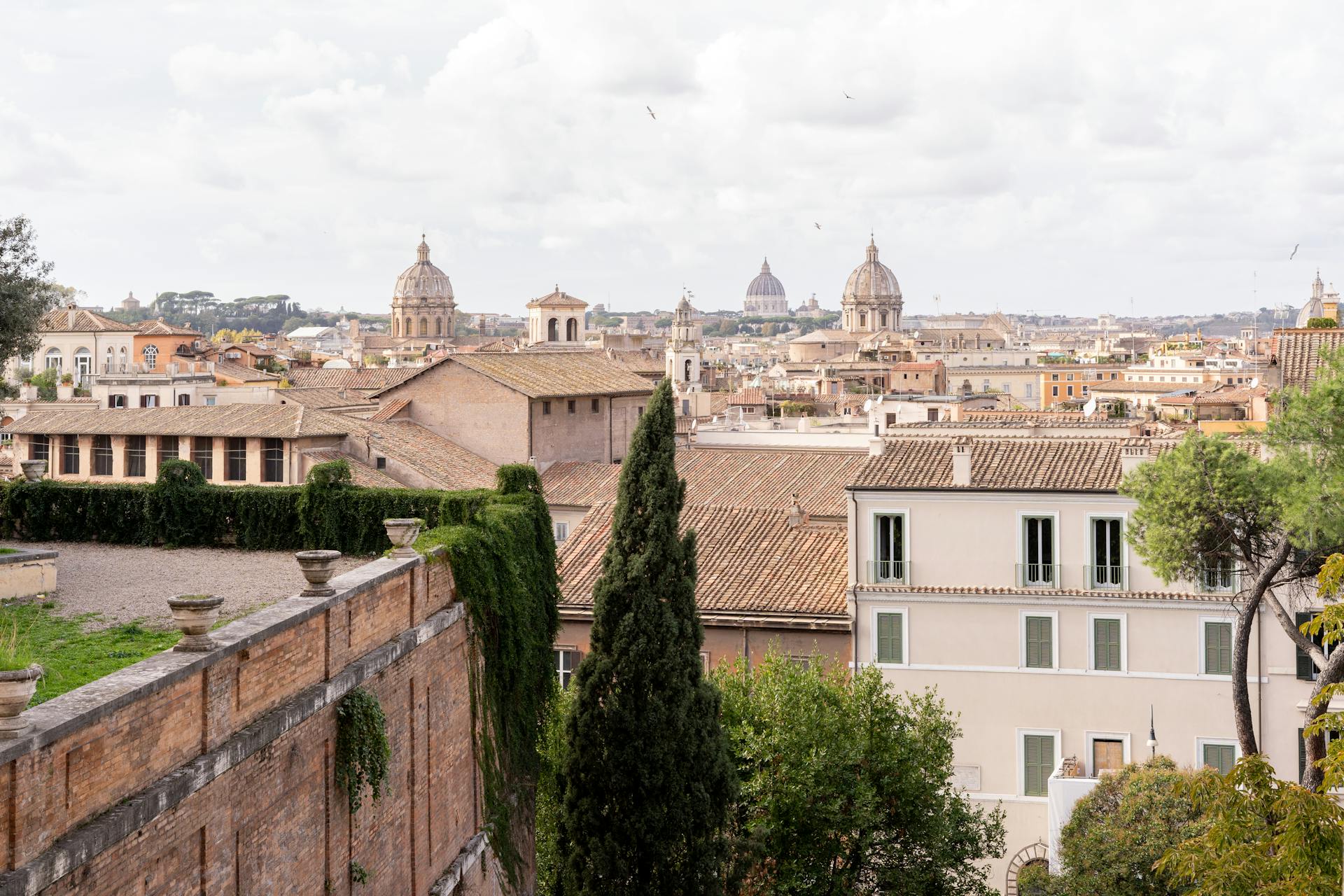 Explore the magnificent cityscape of Rome with its iconic domes and historic architecture.