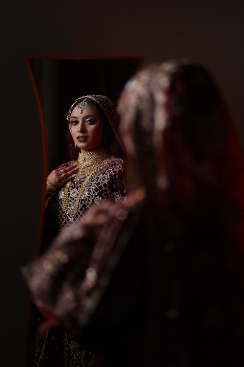 Mirror Reflection of Bride in Traditional Clothing 