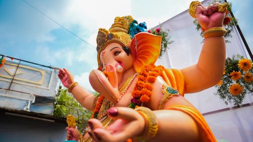 Free Colorful low angle shot of a Ganesha statue during a religious festival in Armur, India. Stock Photo