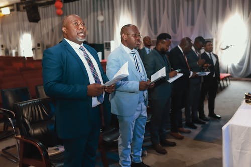 Men in Suits at Ceremony