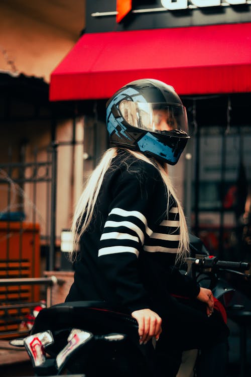 Blond in Helmet Sitting on Motorbike