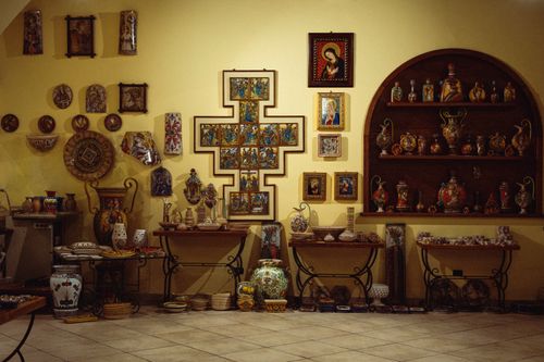 Free A detailed display of various religious artifacts and art pieces on a wall. Stock Photo