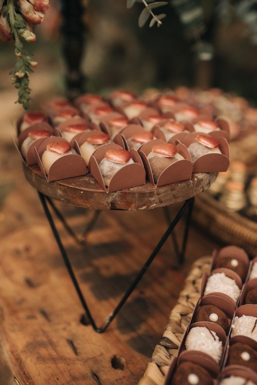 Free Delicious chocolate desserts artfully arranged at a rustic indoor event, highlighting sweet treats. Stock Photo
