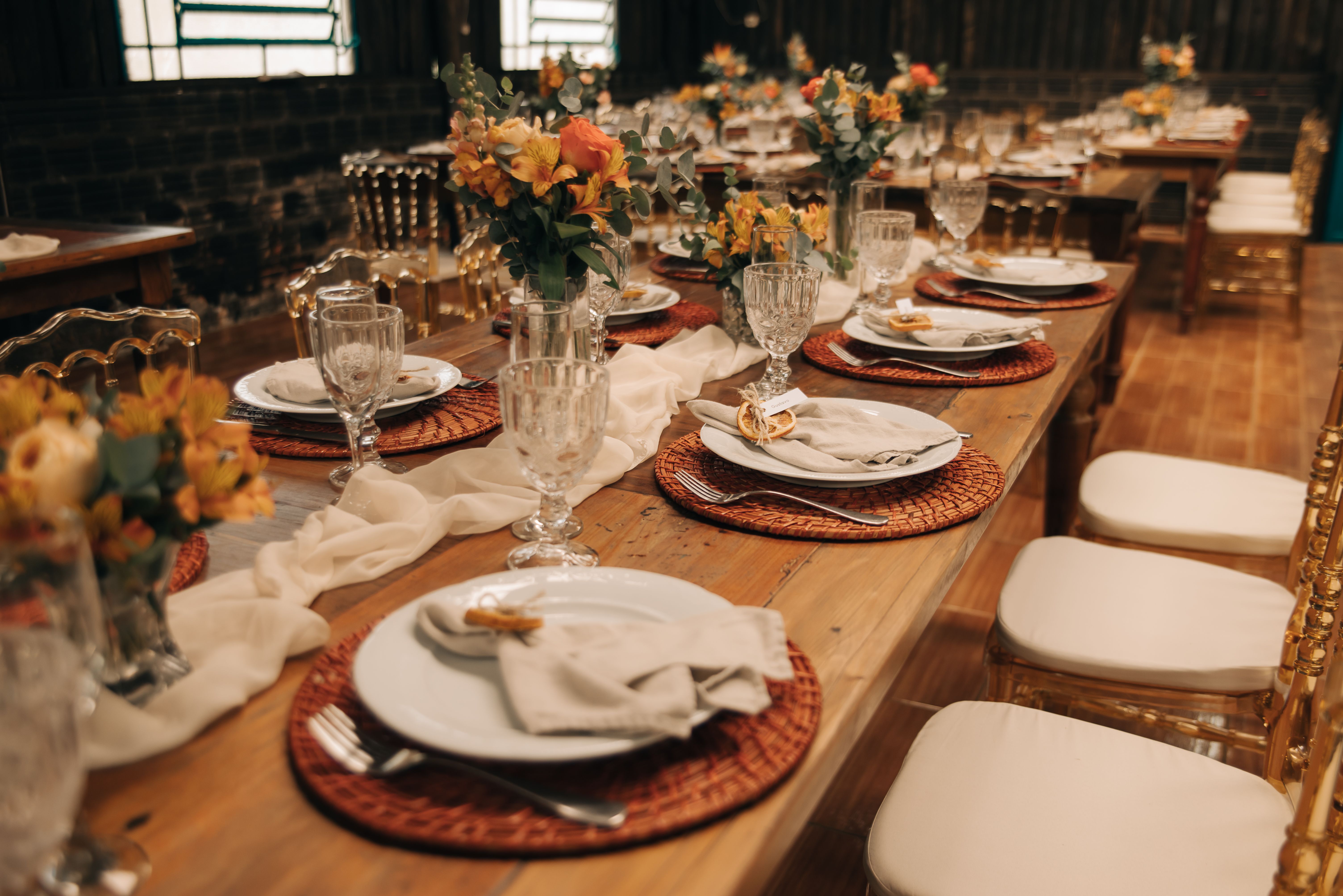 Beautifully arranged wedding reception table with floral centerpieces and elegant tableware.