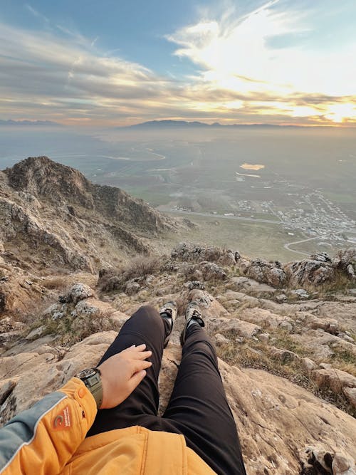 A Person Sitting on a Rock