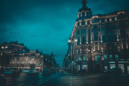 Free A vibrant evening view of a street in Saint Petersburg, showcasing historic architecture and urban life. Stock Photo