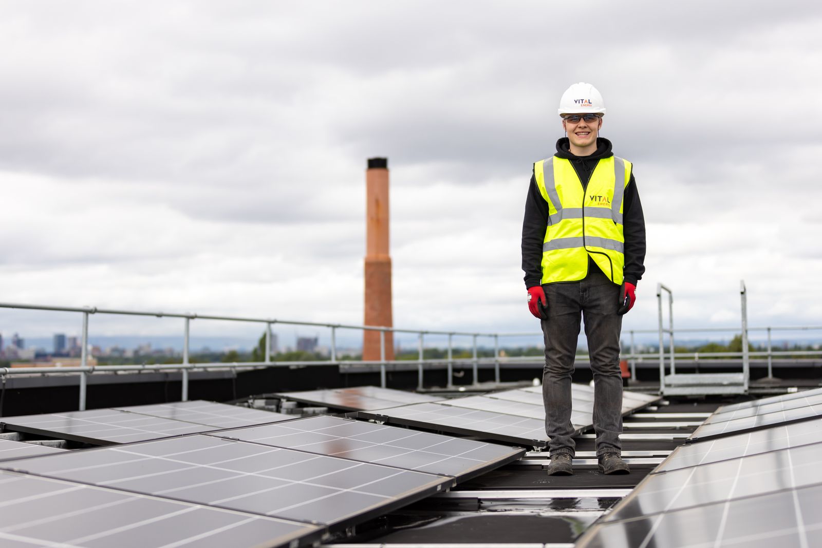 Representative energy engineer inspecting a solar installation