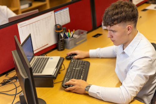 White Collar Worker Sitting at Desk with Computer