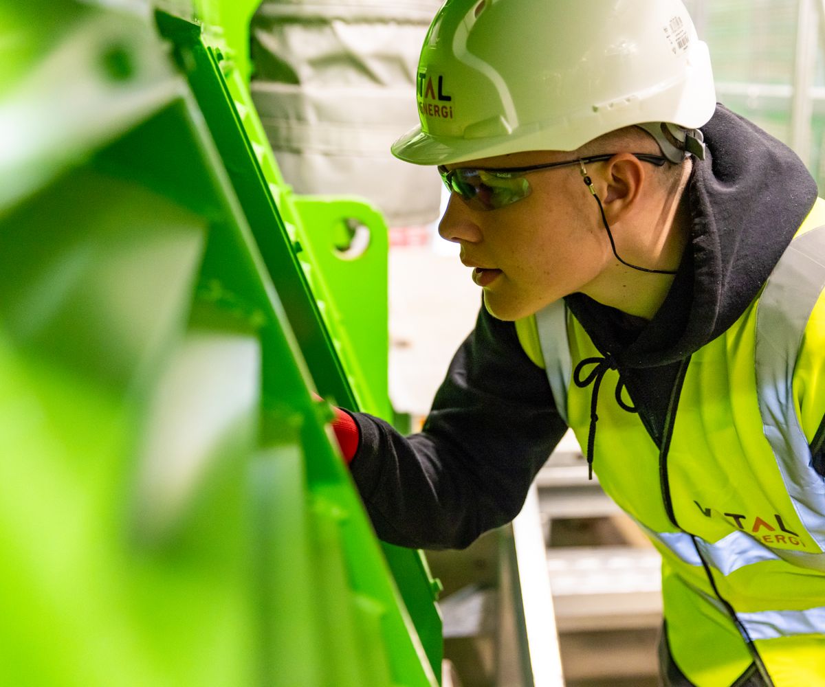 Quality inspector examining protective clothing