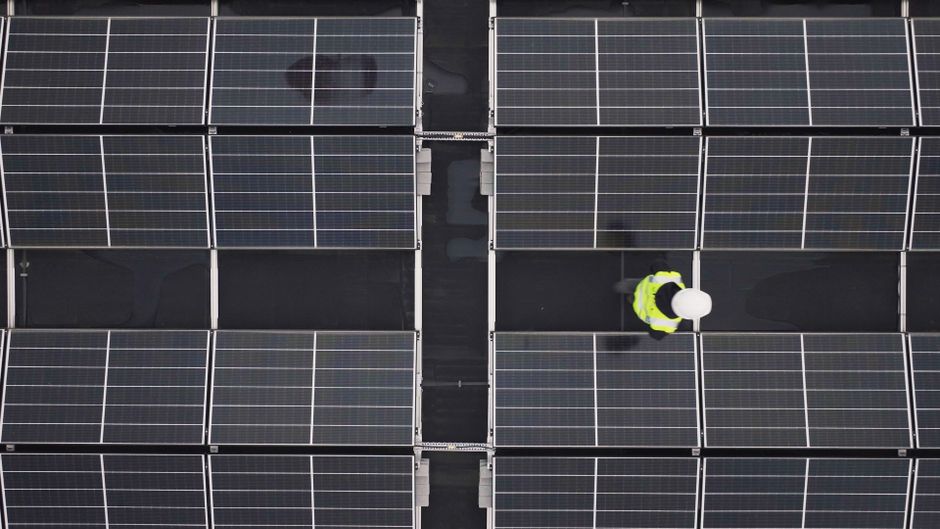 Solar technician repairing panels on an Anaheim California home