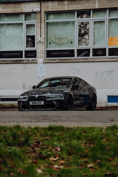 Black BMW M4 Parked in Front of the Building