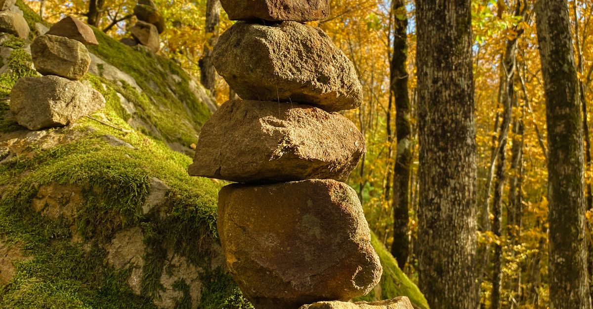 Woods With Rocks A stack of rocks in the woods with fall colors · Free Stock Photo