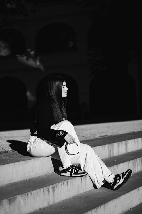 Young Woman Sitting on the Steps