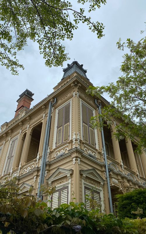 Free Low angle view of an ornate Ottoman mansion in Istanbul surrounded by spring foliage. Stock Photo