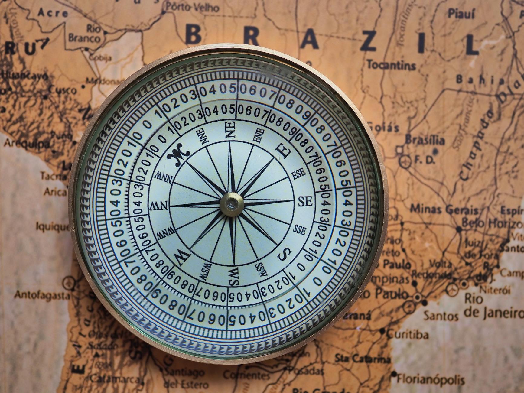 A compass on a map with the word brazil