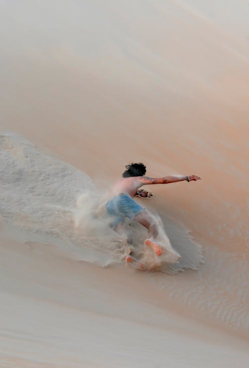 Man Falling Down on Beach